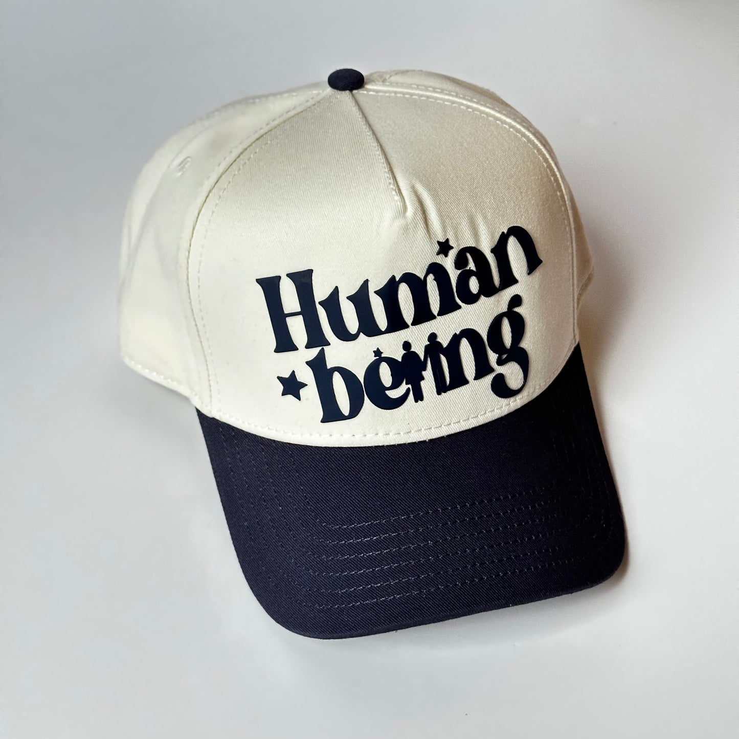 HUMAN BEING Natural/ Navy SNAPBACK