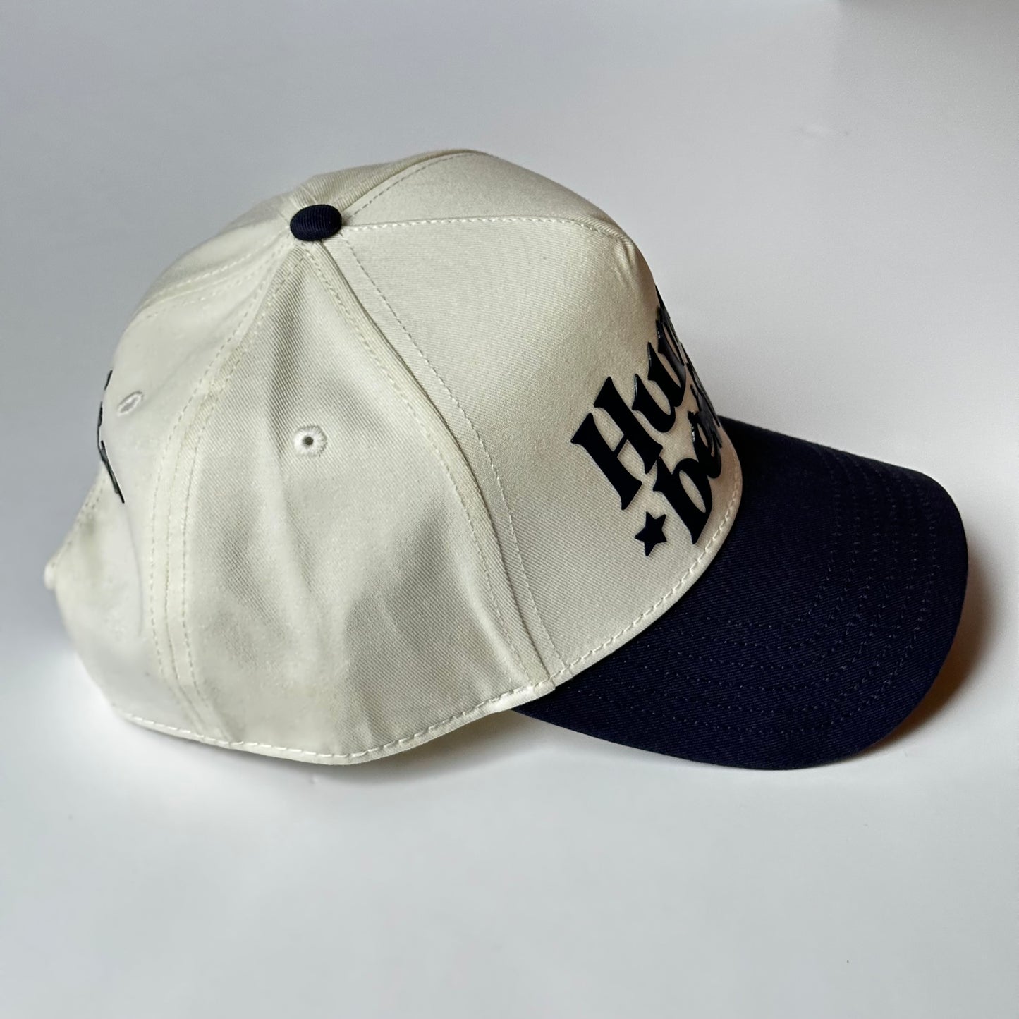 HUMAN BEING Natural/ Navy SNAPBACK