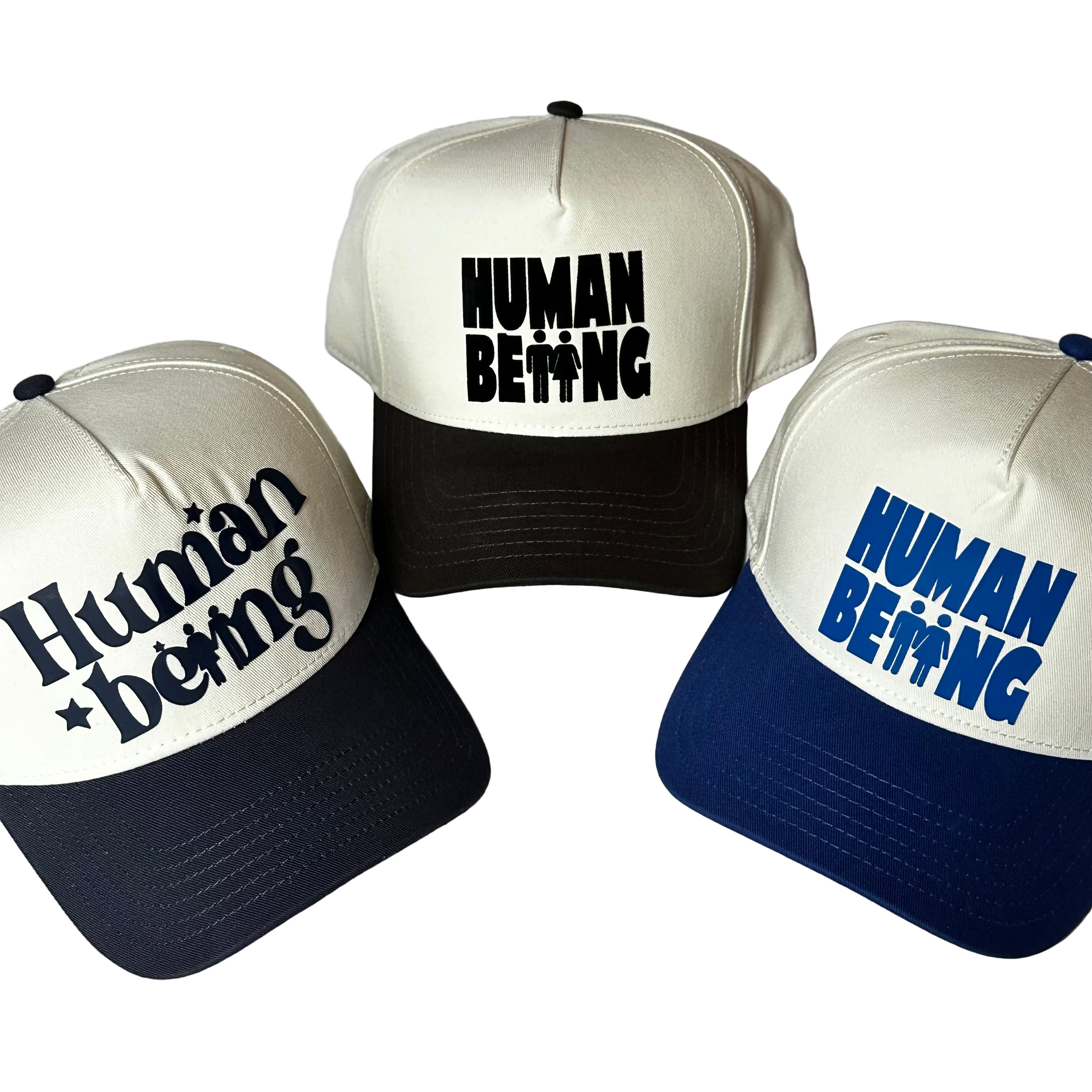 Three hats with 'Human Being' text on a white background